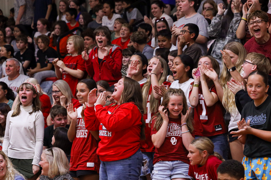 Claremore students cheer in the bleachers.