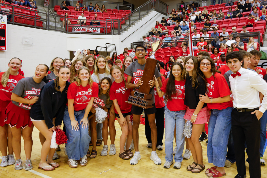CHS students celebrate with a trophy.