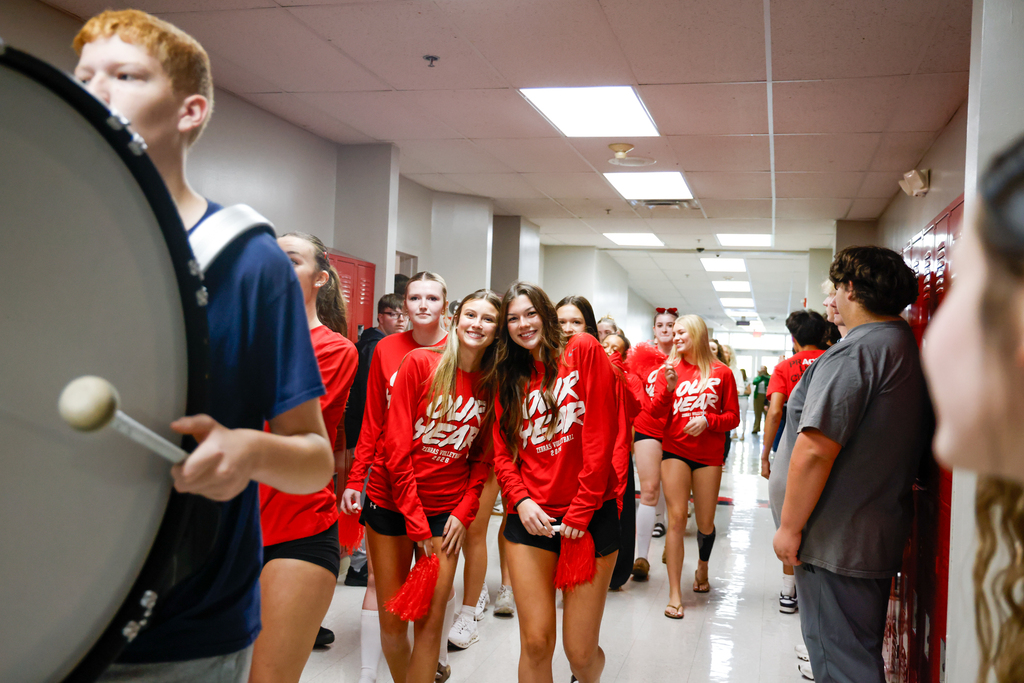 Lady Zebra volleyball players walk through the hallway during their State send-off.