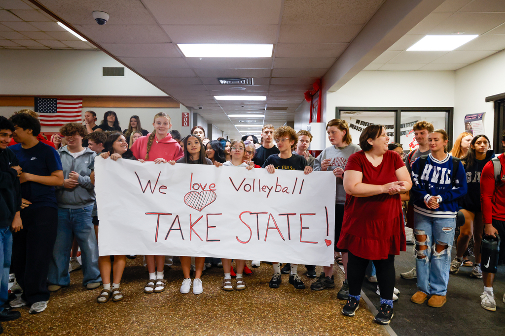 Claremore students hold a handmade volleyball State Tournament sign during the send-off.