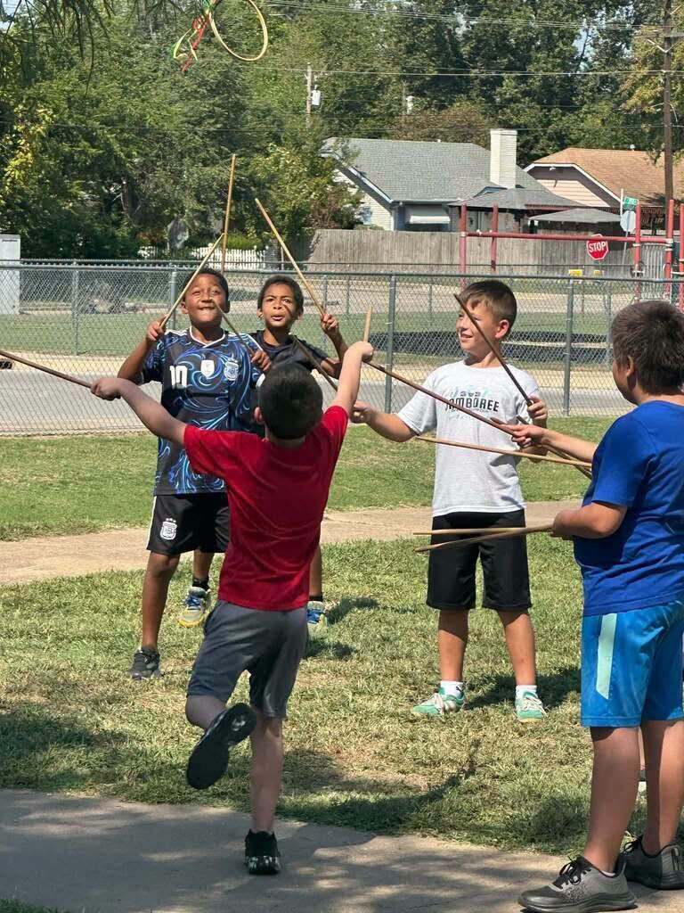 Claremont students participate in a traditional Cherokee stickball activity.