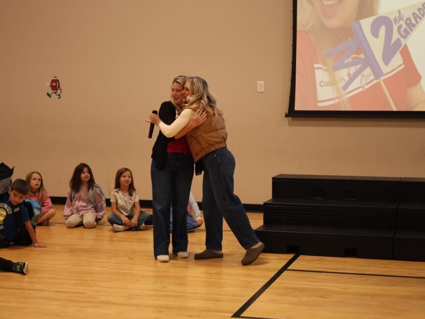 Ms. Fay and Mrs. Stanart hugging