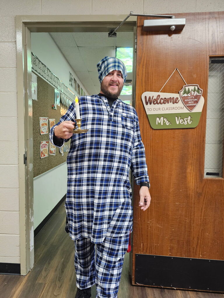 teacher wearing plaid with a candle