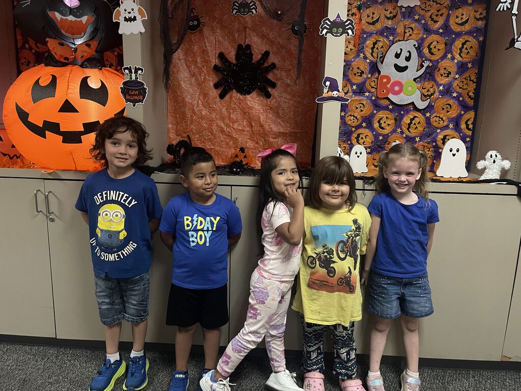 5 students wearing pjs and blue