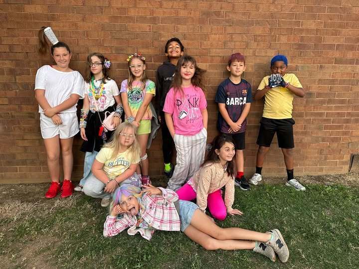 10 students with crazy hair smiling