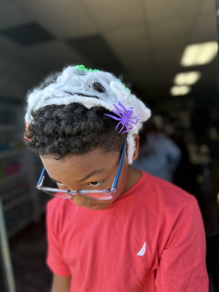 student showing off spider web hair