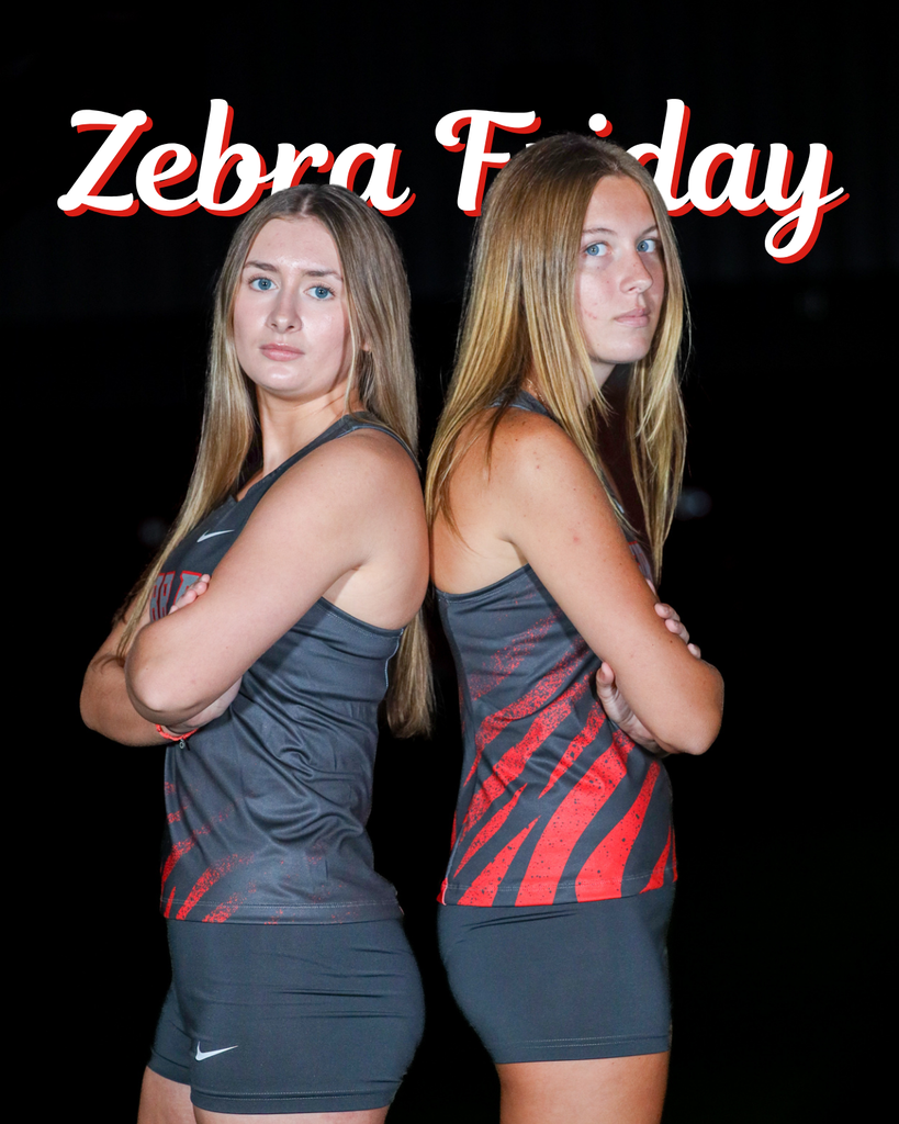 Two Zebra cross country runners stand back-to-back in gray and red uniforms. Text reads “Zebra Friday.”