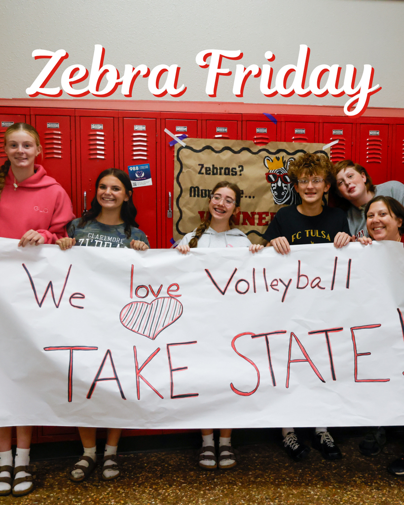 Students hold a handmade “We Love Volleyball, Take State” banner in front of red lockers. Text reads “Zebra Friday.”