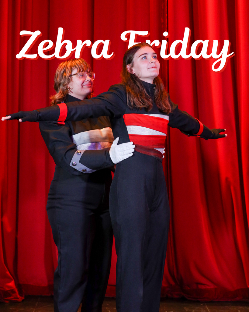 Two color guard members pose in black and red uniforms in front of a red curtain. Text reads “Zebra Friday.”