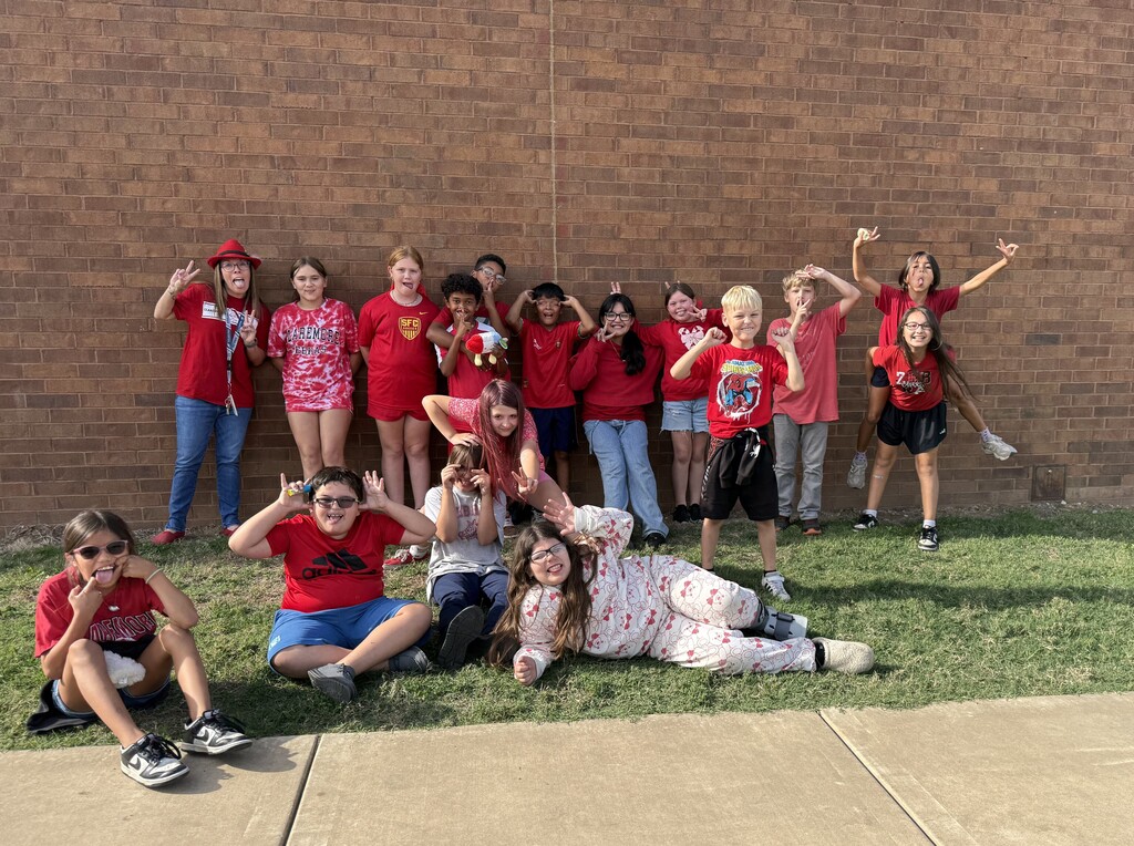 large group of students wearing all red