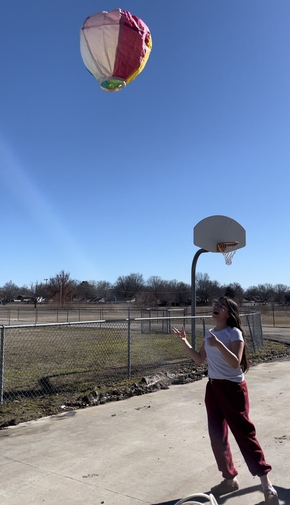 student with homemade hot air balloon