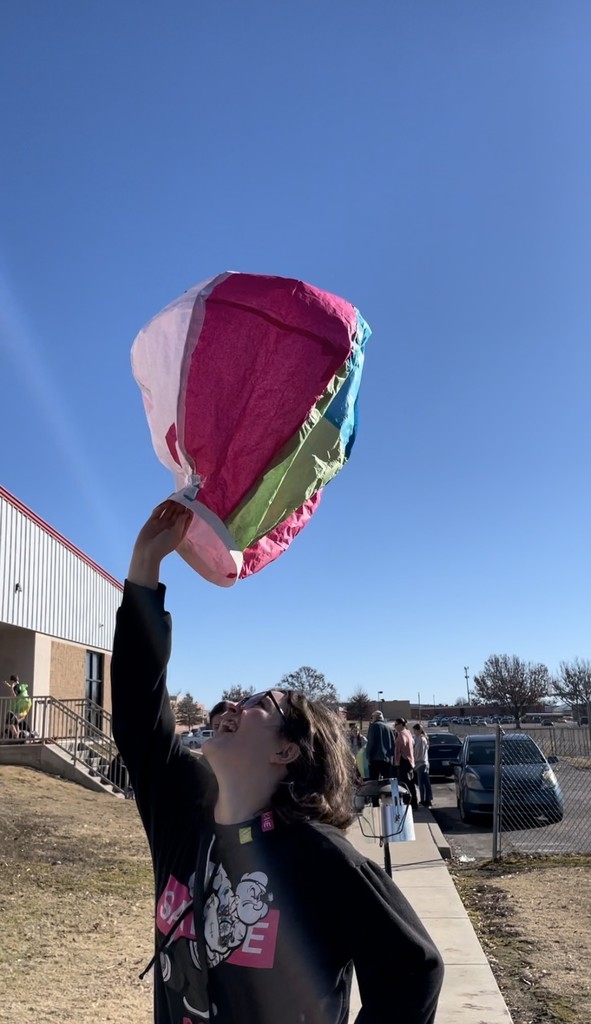 student with homemade hot air balloon