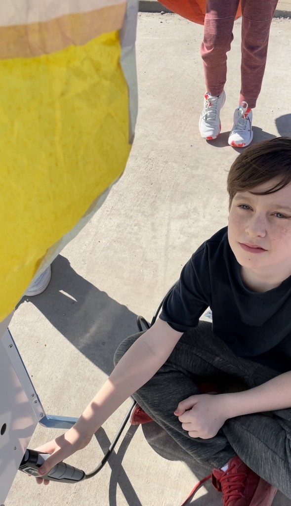 student with homemade hot air balloon