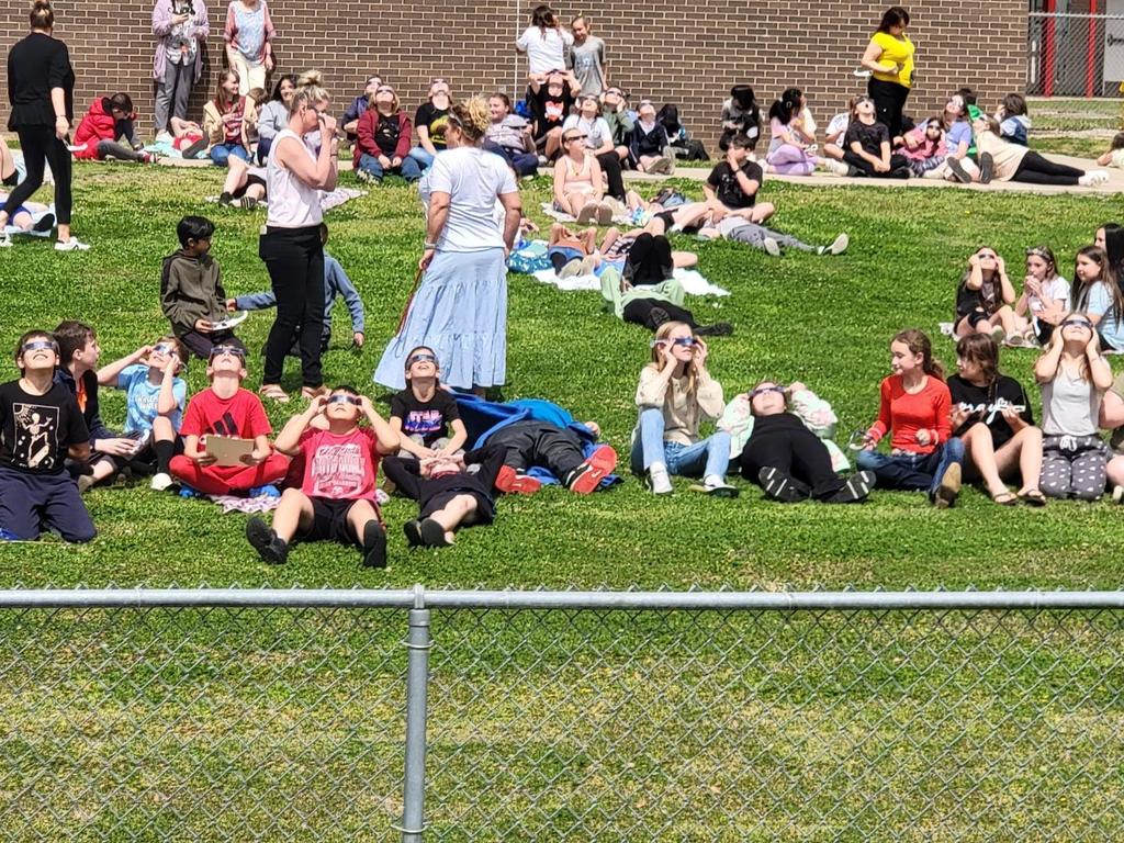 students observing the eclipse