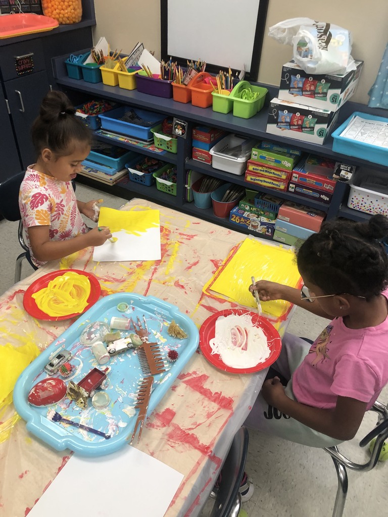 students creating collages in eric carle style