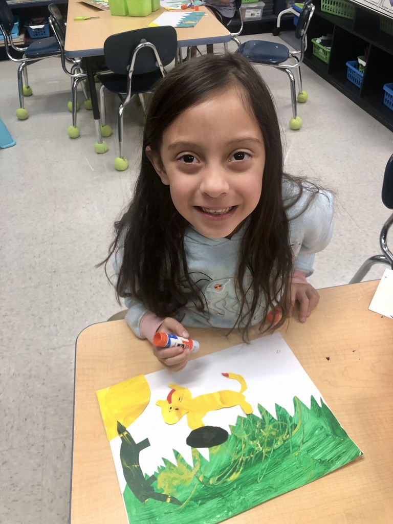 student showing off artwork