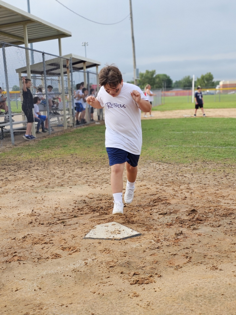 student playing kickball
