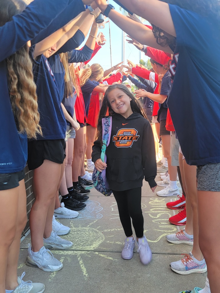 student being welcomed back on first day
