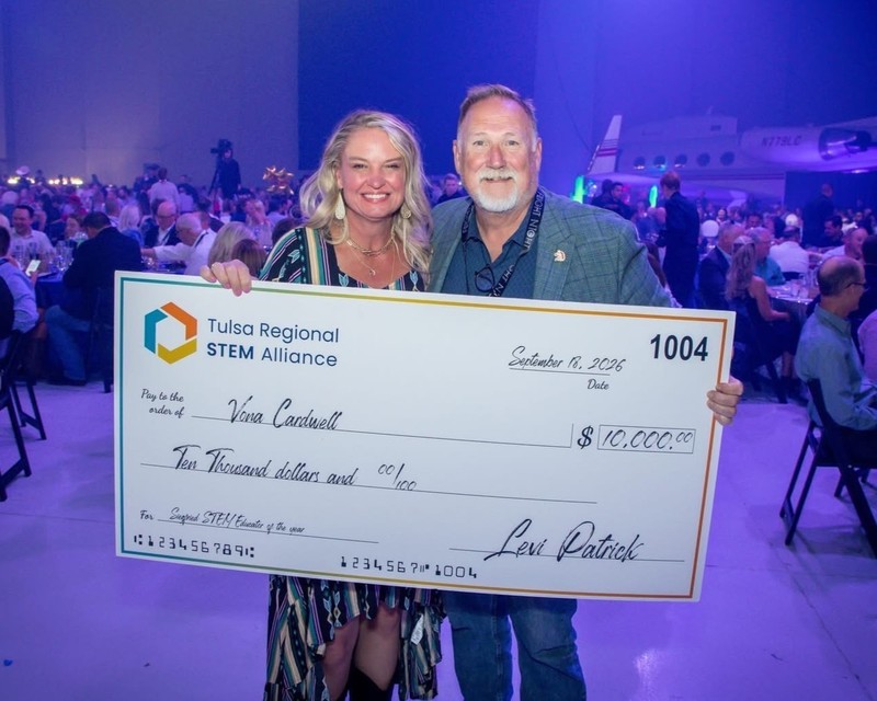 frazier and vonna with big check