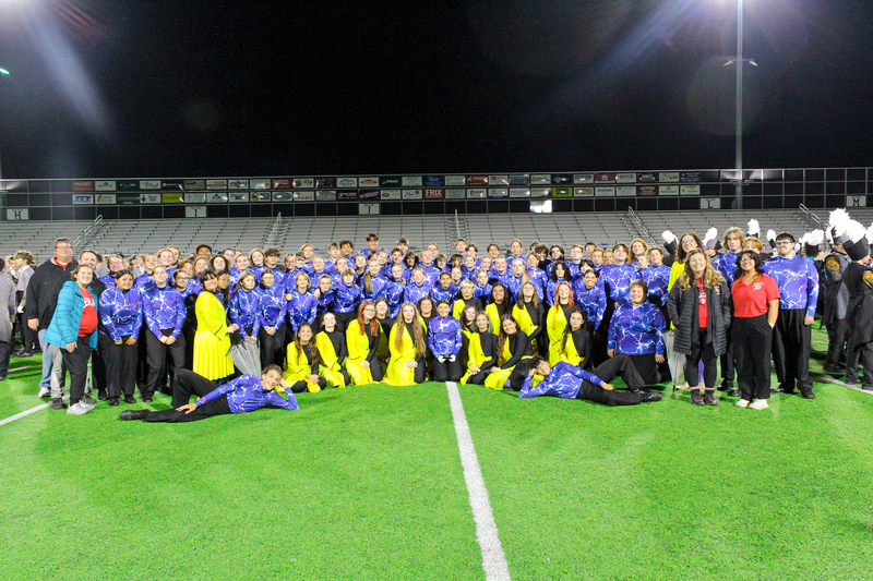 band on field with trophy