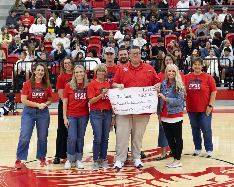 CPSF board members with grant recipient and a large check