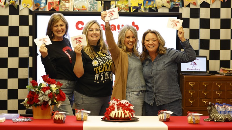 teacher holding cards