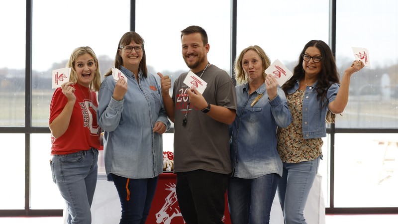 teachers with award cards