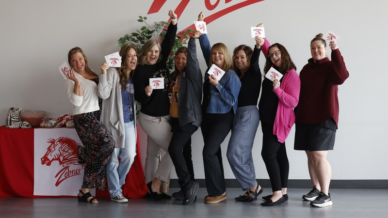 teacher holding cards