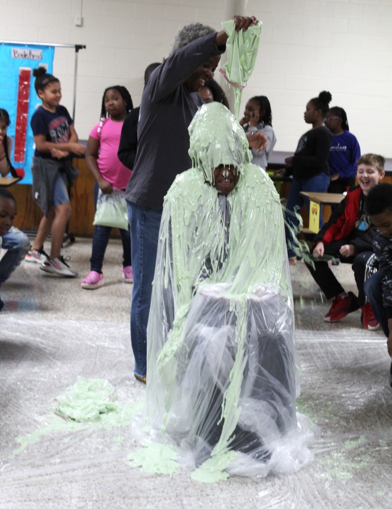 She is staying still but they keep pouring slime.