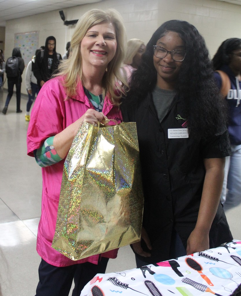 Mrs. Graham giving Nevaeh Garland her prize.