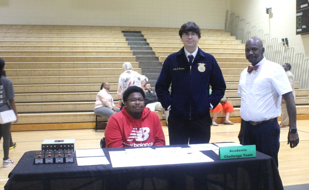 Mr. Williams and two of our MHS students