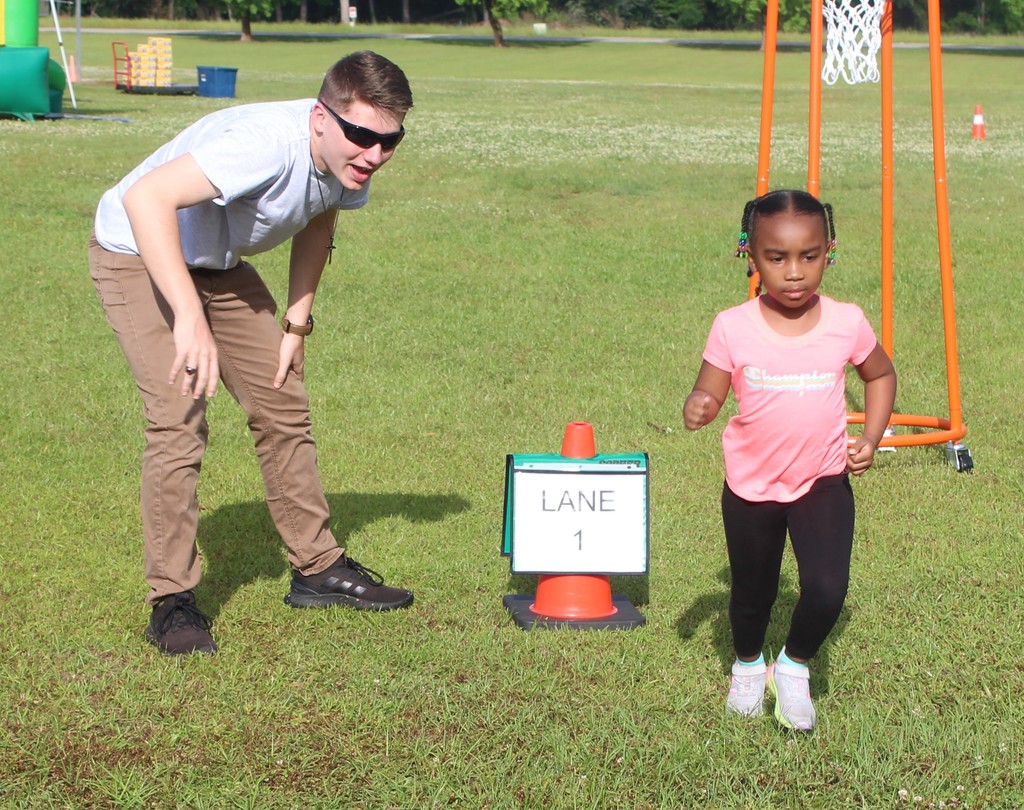 Helping her with the relay race.