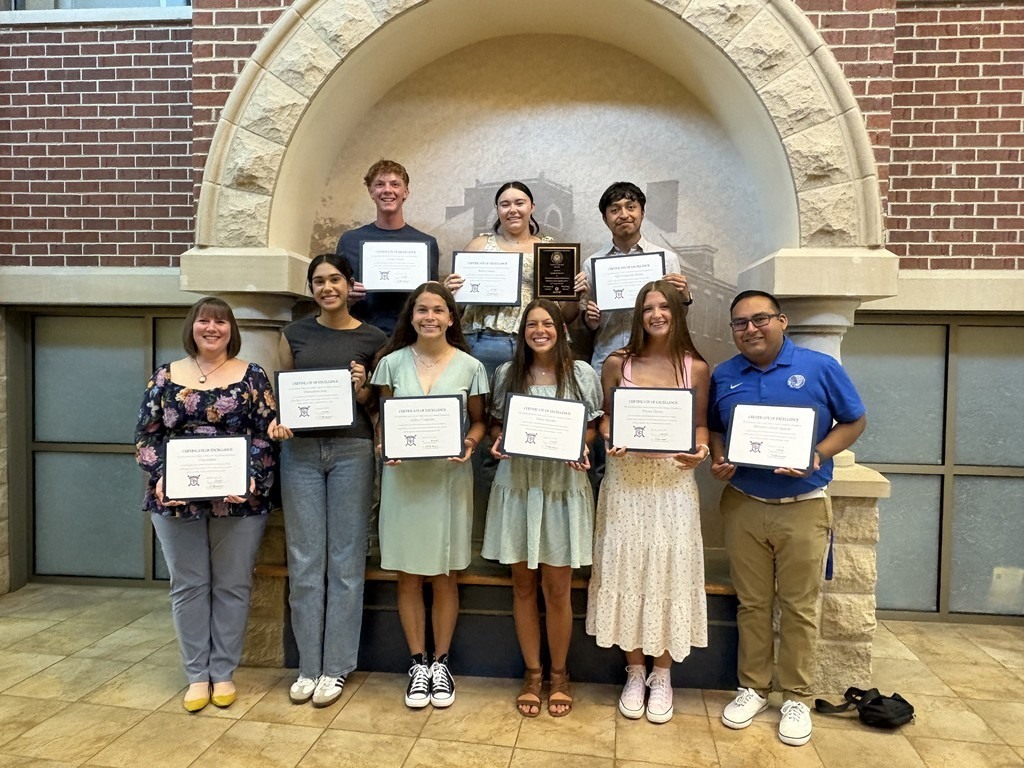 Mizraim Lorenzo-Aguilar, right, with his Spanish Honor Society students