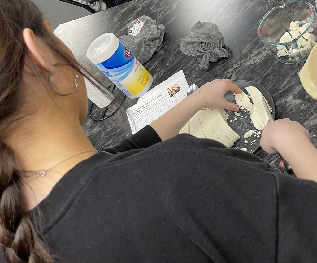Student chopping cheese