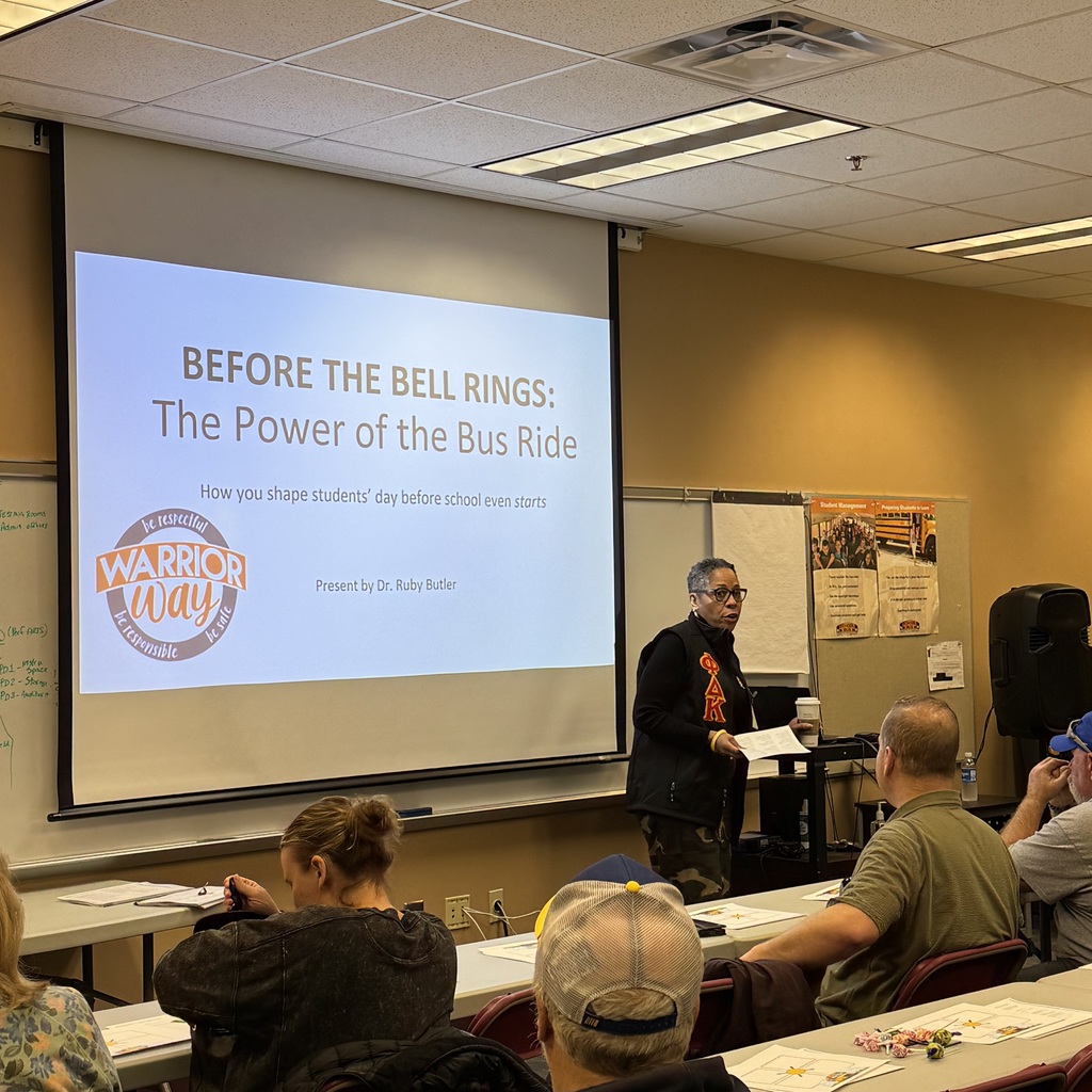 Dr. Butler talking to Bus Drivers