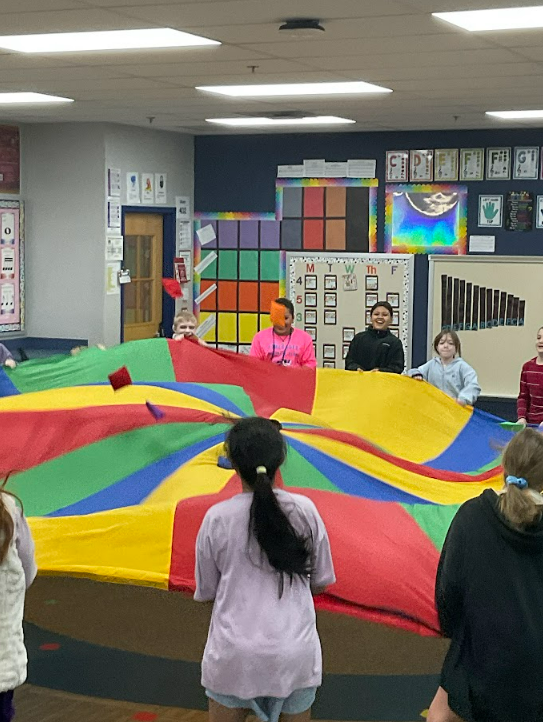 Kids playing with parachute