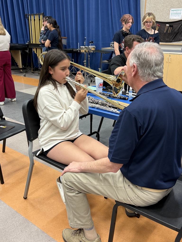 Student trying instrument