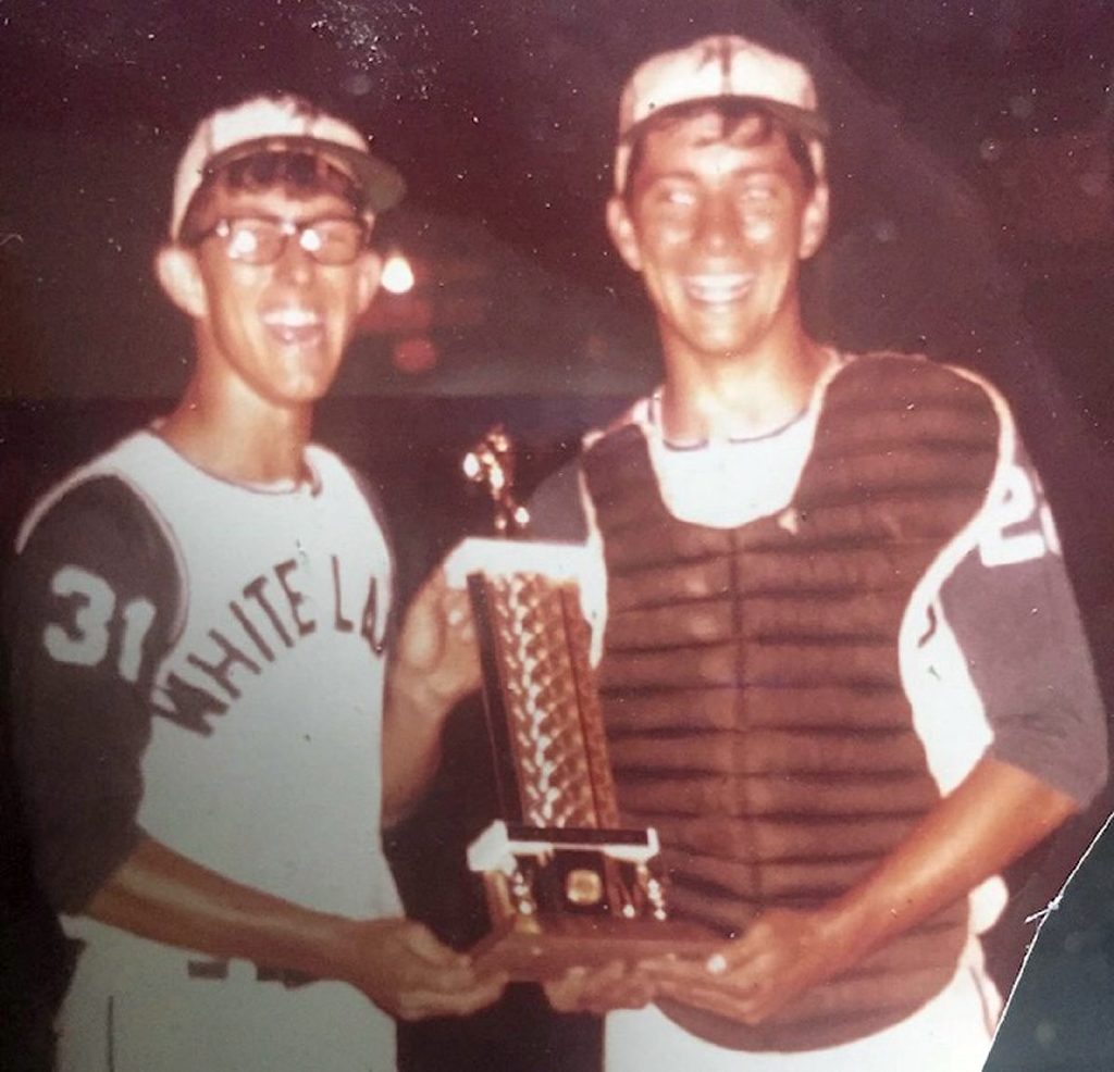 Butch Zike and another player holding sectional championship trophy in 1968