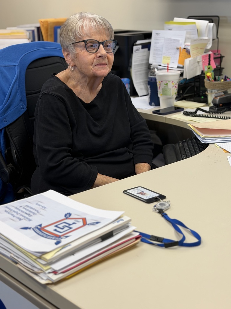 Charm at her desk