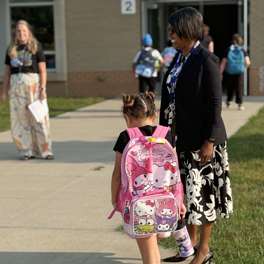Dr. Shipp Smiling with girl with hello kitty backpack