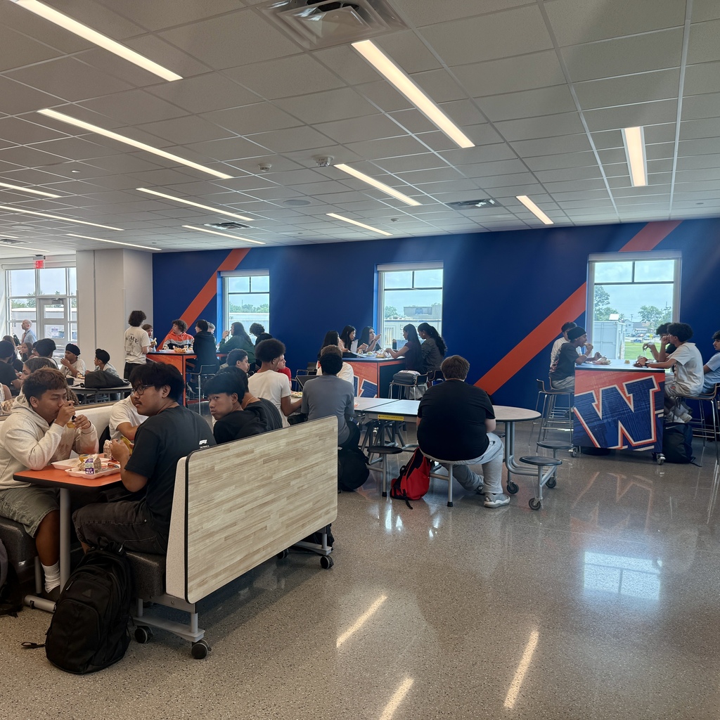 Kids with W wall in cafeteria