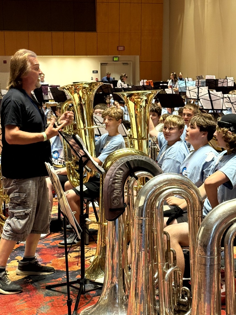 Tuba players with instructor