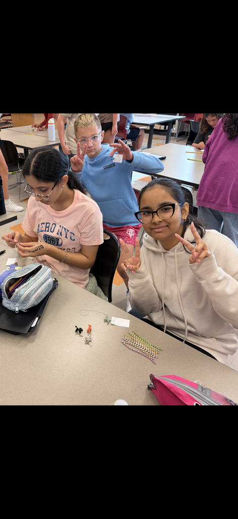 students making friendship bracelets