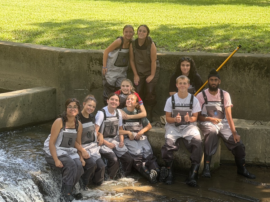 Students posing in the water