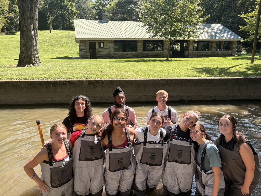 Kids in waders in the water