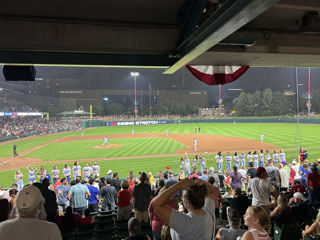 Lined up on field with players on field