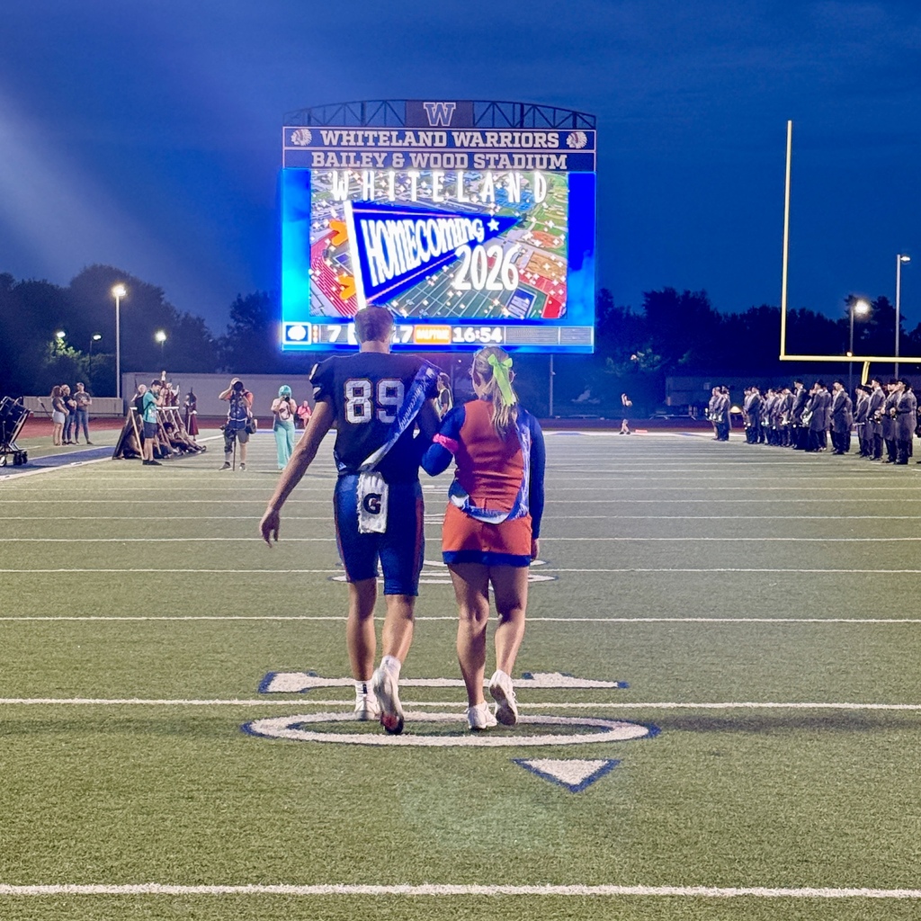 football player and cheerleader on homecoming court