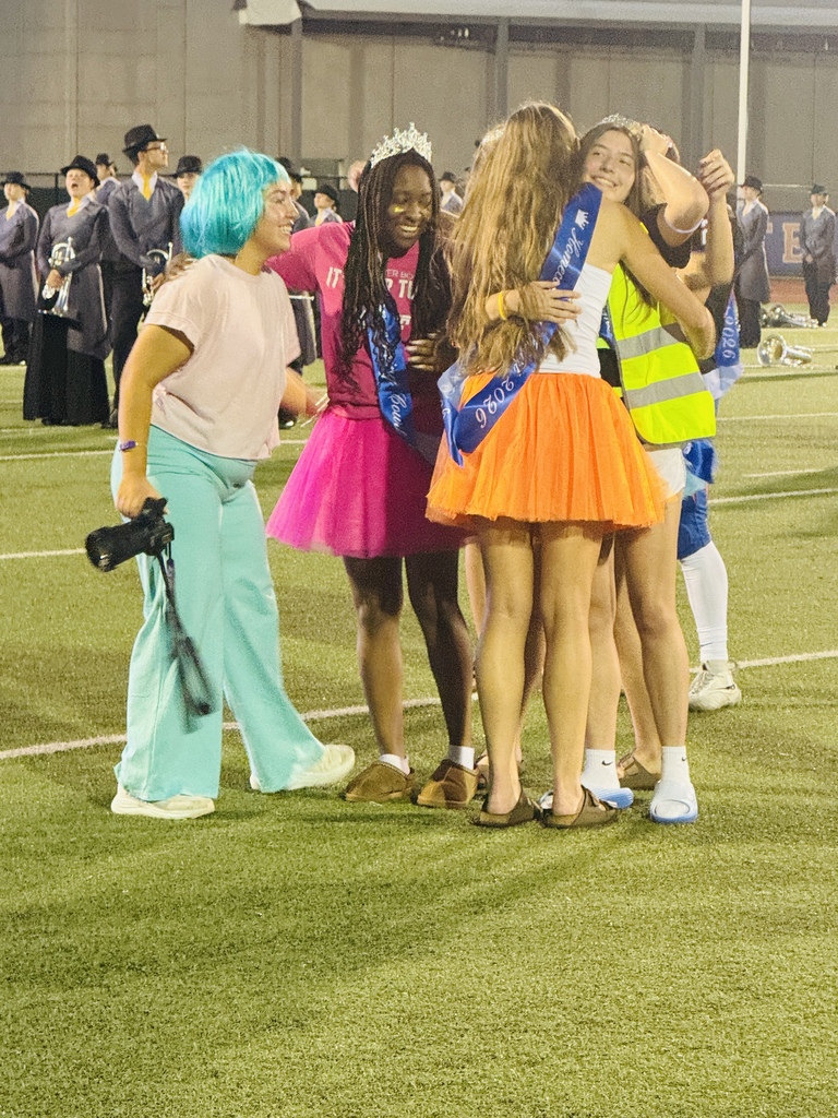 Homecoming court winners getting hugged