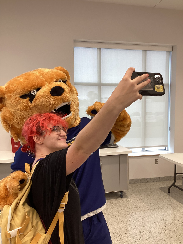 girl taking selfie with griz