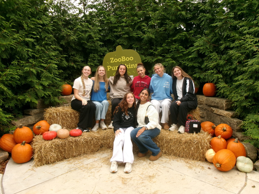 Kids at zoo with fall backdrop